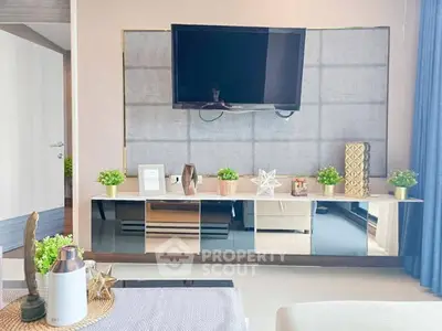 Modern living room with wall-mounted TV and stylish decor