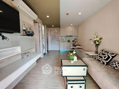 Modern living room with stylish decor and open kitchen layout in a contemporary apartment.