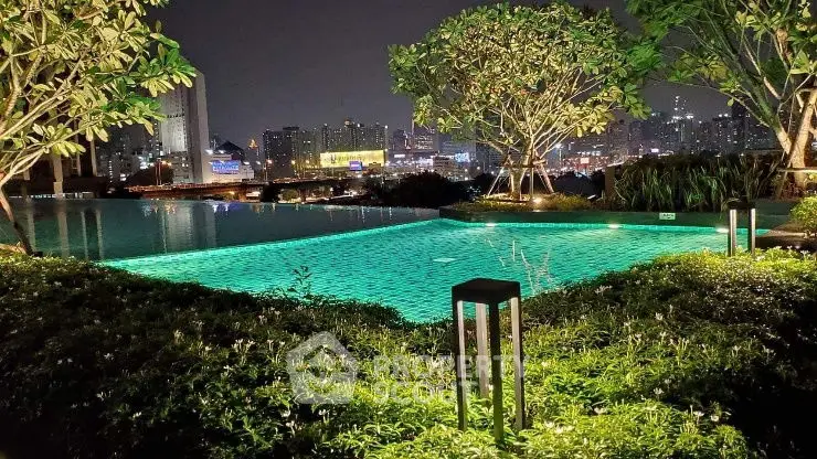 Luxurious rooftop pool with stunning city skyline view at night