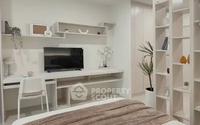Modern bedroom with stylish desk and shelving, perfect for work and relaxation.