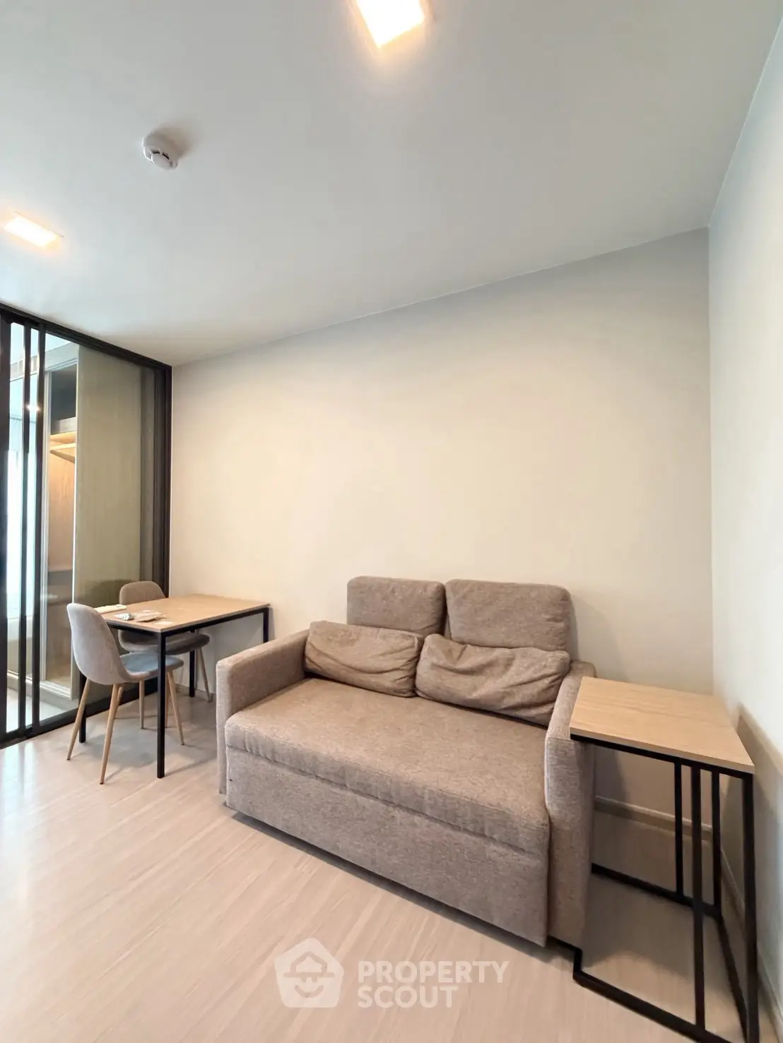 Modern living room with cozy sofa and dining area in a stylish apartment