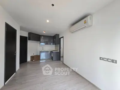 Modern apartment interior with sleek kitchen and air conditioning