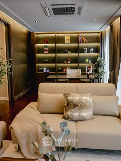 Luxurious living room with modern decor and built-in shelving, perfect for stylish urban living.