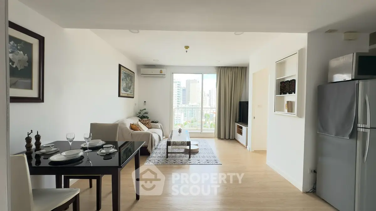 Spacious modern living room with city view, open layout, and elegant decor.