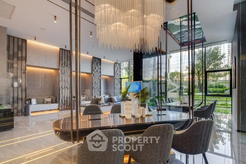 Luxurious modern living room with elegant chandelier and garden view