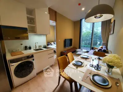 Modern open-plan kitchen and living area with dining table and balcony view