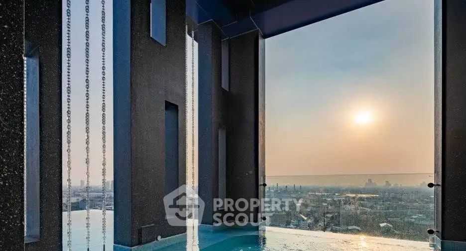 Luxurious rooftop pool with stunning city view at sunset, perfect for relaxation and leisure.