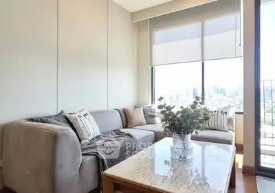 Chic living room with cozy sectional sofa and city view