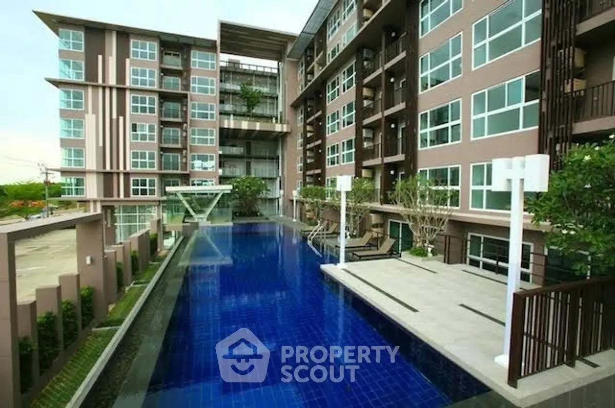 Modern apartment complex with luxurious pool and stylish architecture