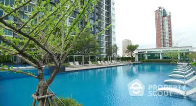 Luxurious condominium with stunning pool and modern amenities in urban setting