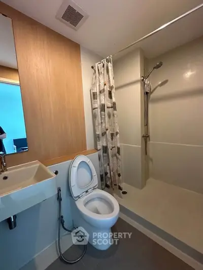 Modern bathroom with shower and toilet in minimalist design