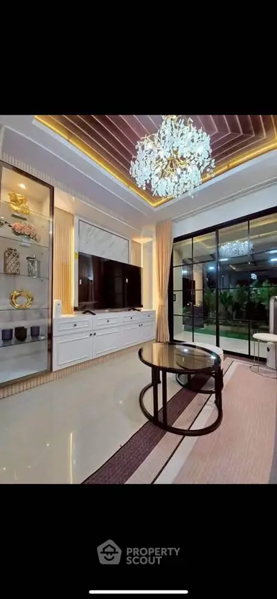 Luxurious living room with elegant chandelier and modern decor