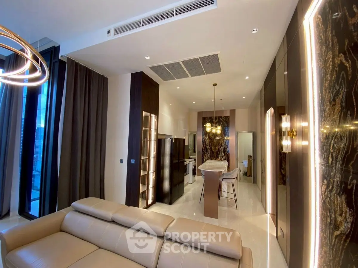 Luxurious modern living room with open kitchen and elegant lighting