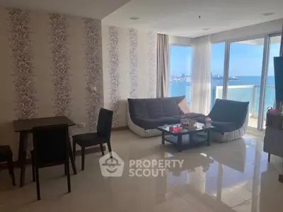 Spacious living room with stunning ocean view and modern furniture