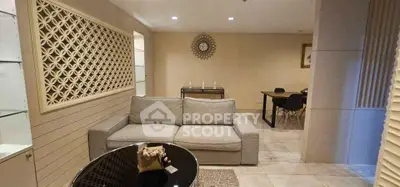 Modern living room with stylish decor and comfortable seating in a contemporary apartment.