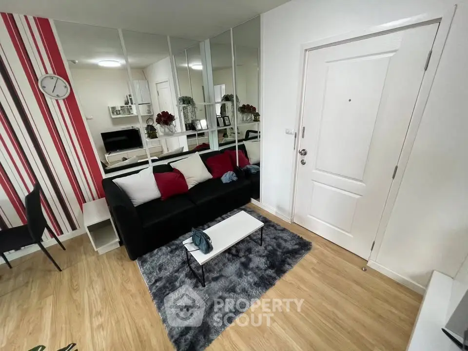 Modern living room with stylish decor and mirrored wall accents