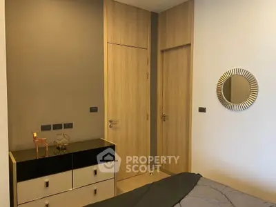 Modern bedroom with stylish decor and wooden accents