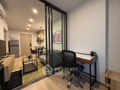 Modern apartment interior with open layout, featuring a cozy living room and stylish study area.