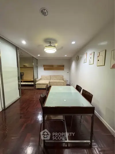 Spacious living room with modern dining area and stylish decor