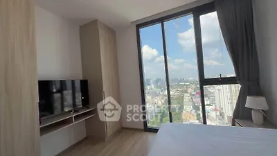 Modern bedroom with stunning city view and large window