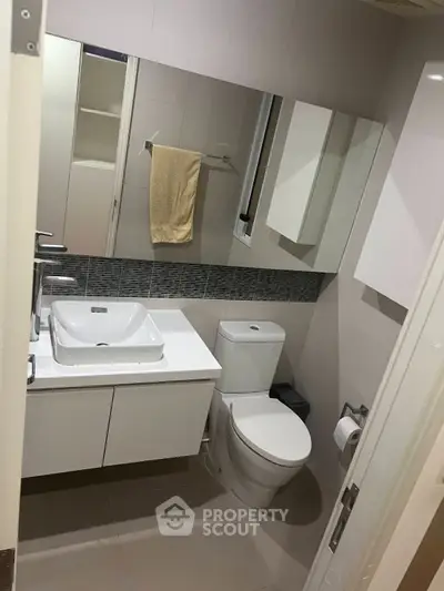 Modern bathroom with sleek fixtures and stylish tile accents