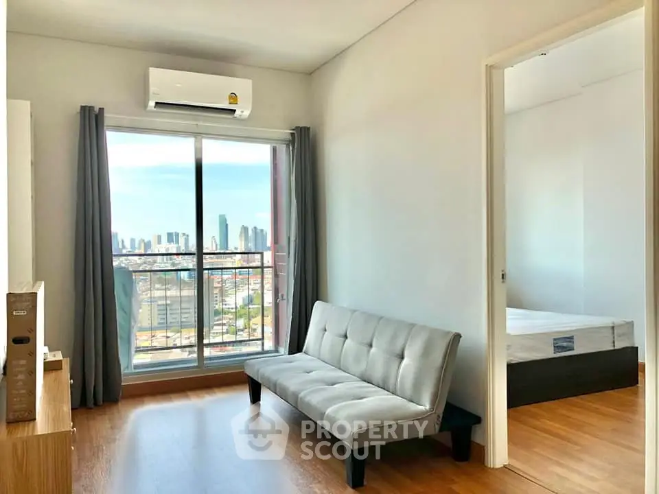 Modern living room with city view and sleek furnishings