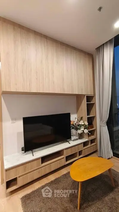 Modern living room with stylish wooden TV unit and cozy decor