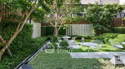 Lush garden with modern outdoor seating and greenery