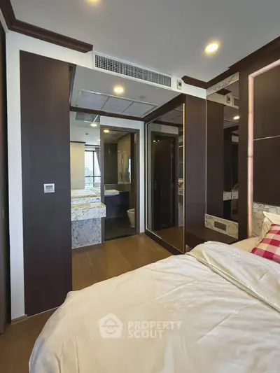 Modern bedroom with ensuite bathroom and stylish decor