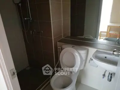 Modern bathroom with shower and toilet in a sleek design