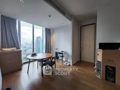Modern apartment with city view, featuring wooden floors and large windows, ideal for urban living.