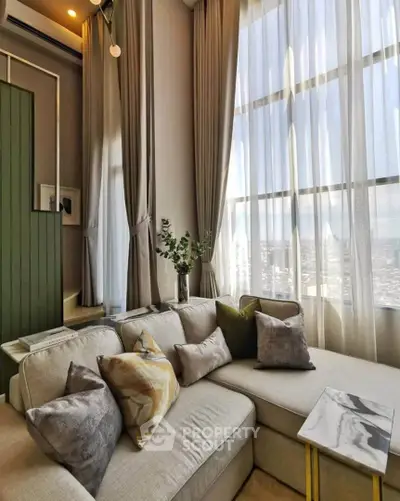 Luxurious living room with high ceilings and elegant decor