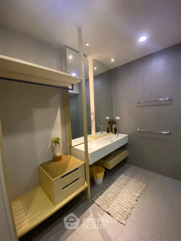 Modern bathroom with sleek design and ample storage space.