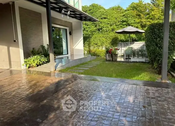 Charming garden view with patio and lush greenery in modern home exterior