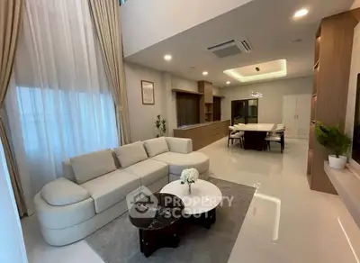 Luxurious open-plan living room with elegant decor and modern furniture