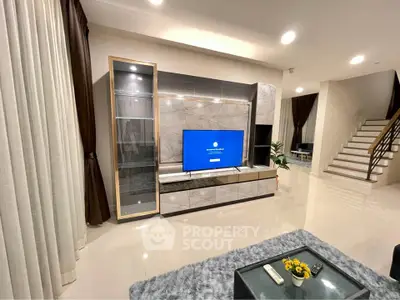 Modern living room with sleek TV unit and elegant decor