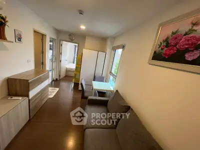 Cozy living room with modern furniture and natural light, perfect for relaxation and entertaining.