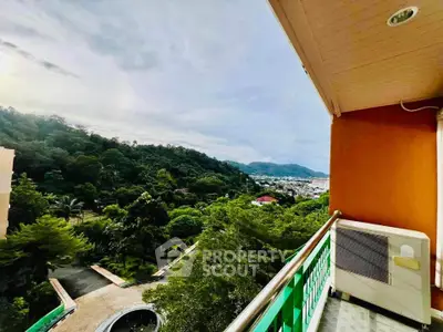 Stunning balcony view overlooking lush greenery and distant mountains, perfect for serene living.