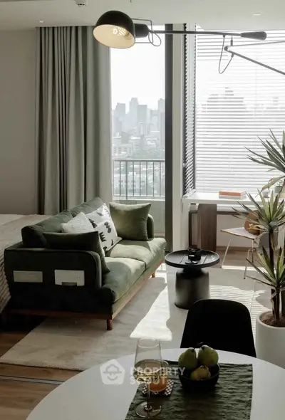 Stylish modern living room with city view, featuring chic furniture and natural light.