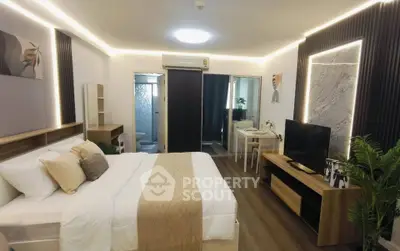 Modern bedroom with stylish decor and ensuite bathroom in a luxury apartment.