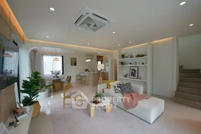 Spacious modern living room with open kitchen and stylish decor