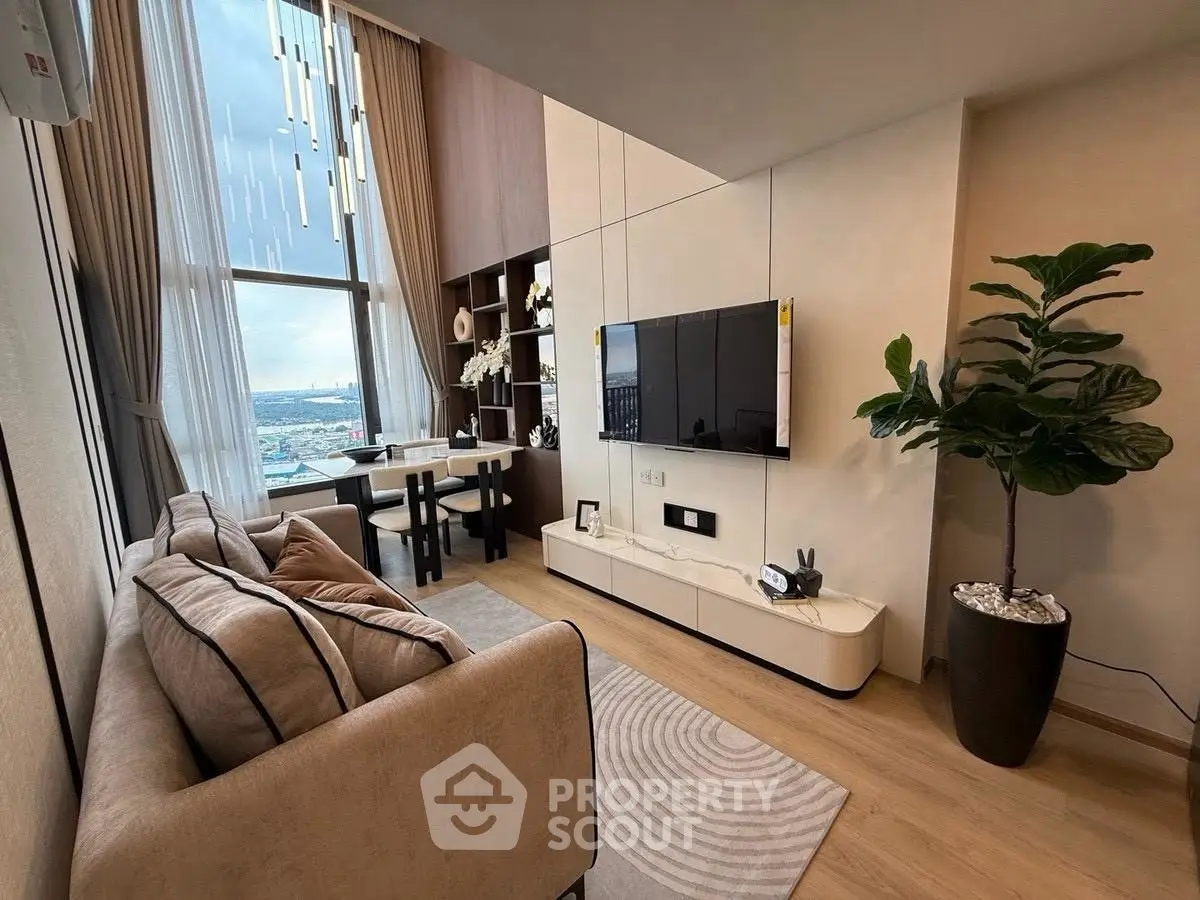 Modern living room with large windows and stylish decor