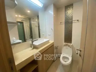 Modern bathroom with sleek fixtures and elegant design in a contemporary apartment.