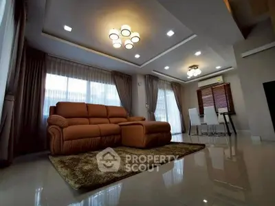 Luxurious living room with modern lighting and plush sofa in elegant home.