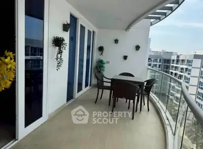 Spacious balcony with modern furniture and city view in luxury apartment