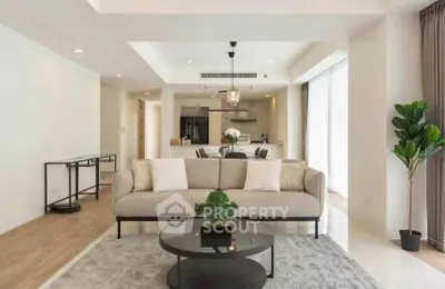 Spacious modern living room with elegant decor and open kitchen layout, perfect for contemporary living.