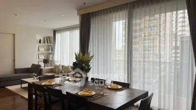 Elegant dining area with large windows and city view in modern apartment