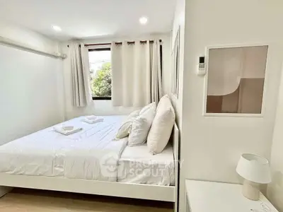 Bright and cozy bedroom with modern decor and natural light