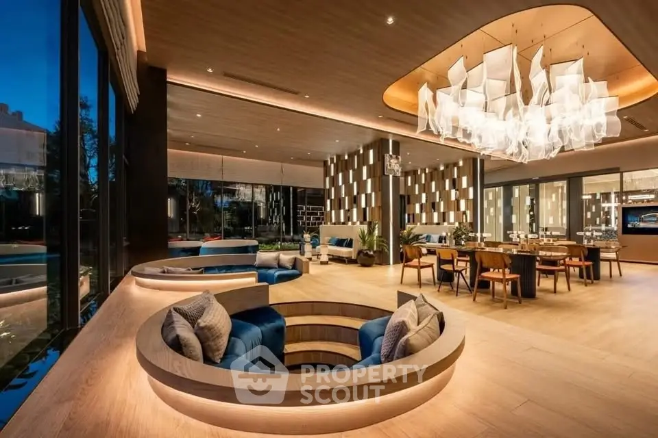 Luxurious modern living room with unique sunken seating and elegant chandelier