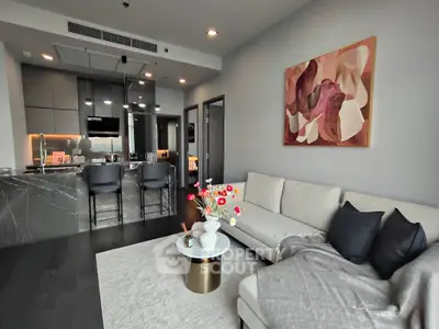 Modern living room with stylish kitchen and elegant decor